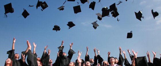 Graduates throwing caps